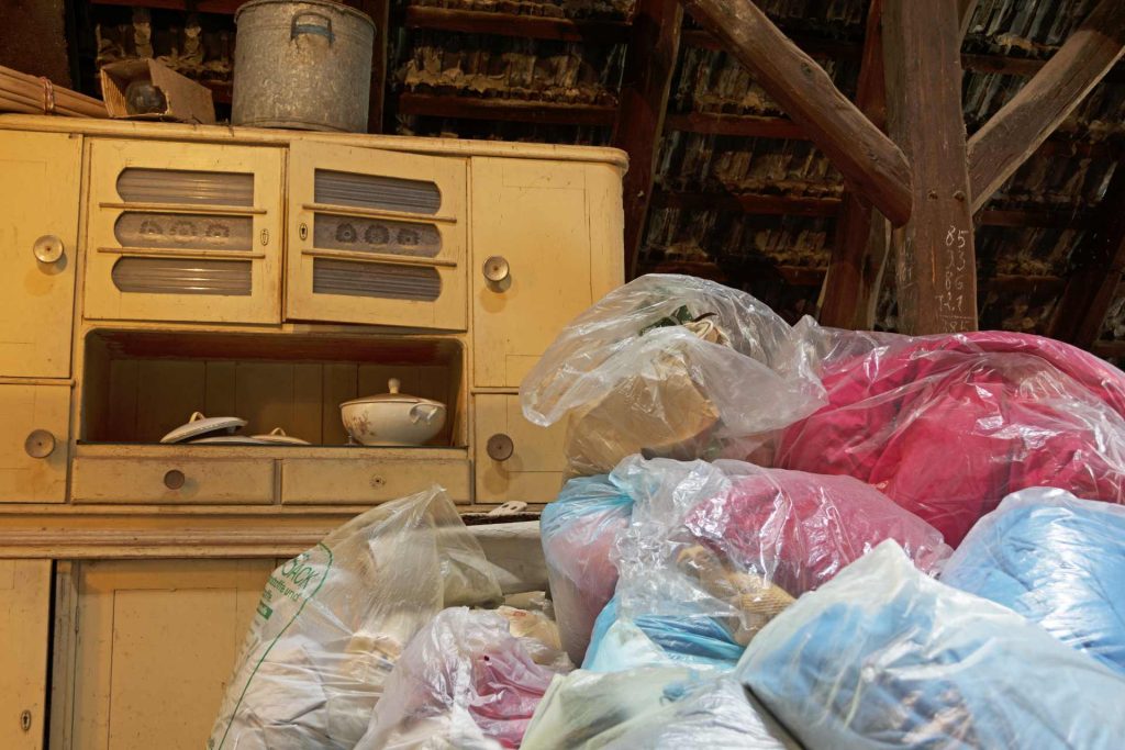 Old storage filled with bags and antiques.